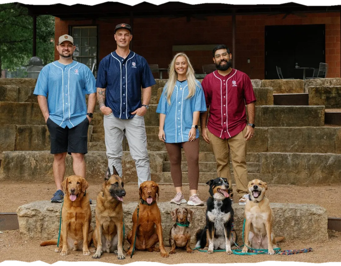The Ivy League Canine Academy training team with client dogs in San Antonio